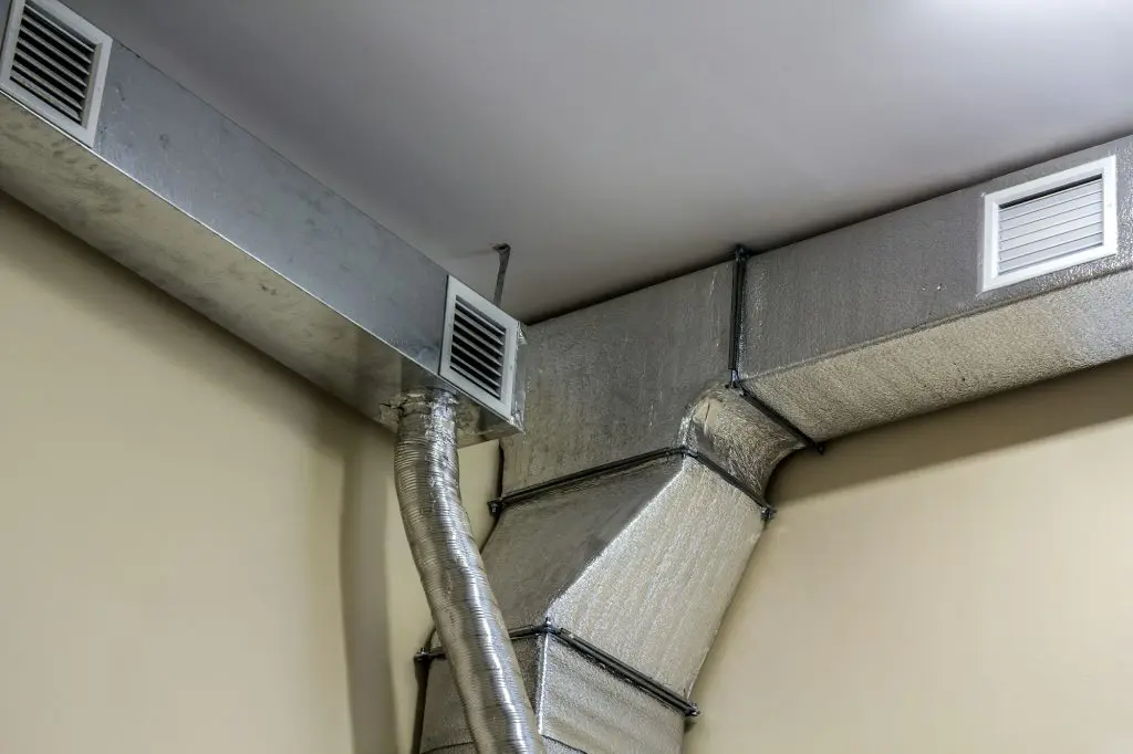 Industrial air duct ventilation equipment and pipe systems installed on industrial building ceiling